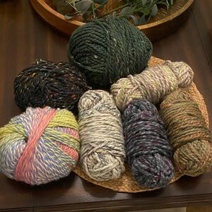 Bundle of wool blend yarn skeins including Wool Ease & Schoppel Wolle Edition 3